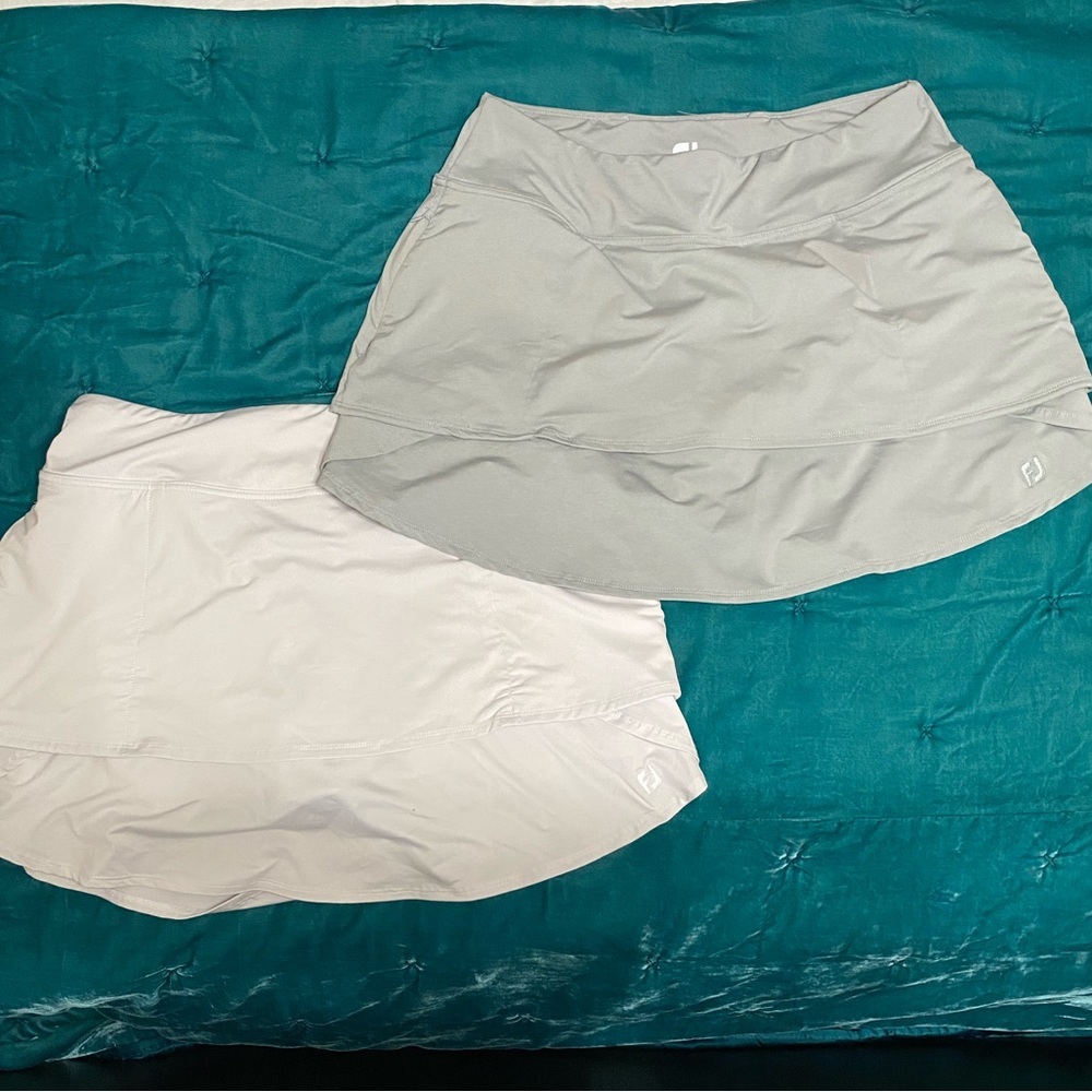 Pair of grey and light grey Fit Joy golf skorts. Size Large